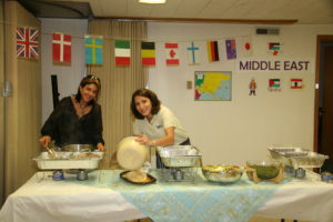 Rula Hanania and Aline Hamati Haddad serve Middle Eastern cuisine they personally prepared at a past UPC Ethnic Food Fair.